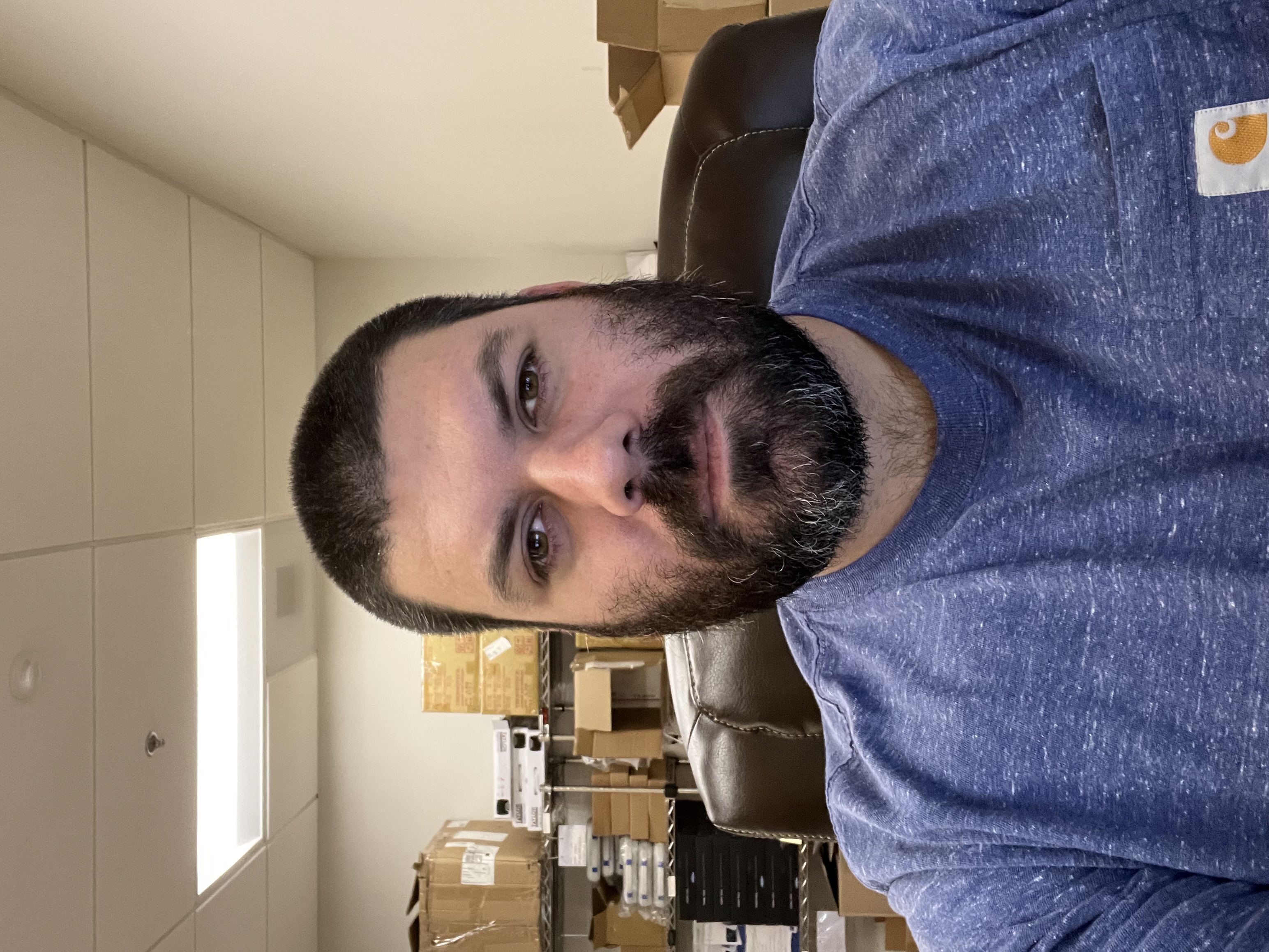 Ryan Mohnach, Founder & Lead Researcher of SoleraEase, at his desk in the VA prosthetics office.